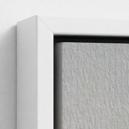 Close-up of a white frame corner on a textured gray surface