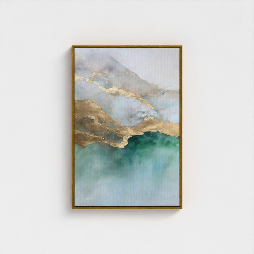 Framed abstract art with gold and green hues on a white wall