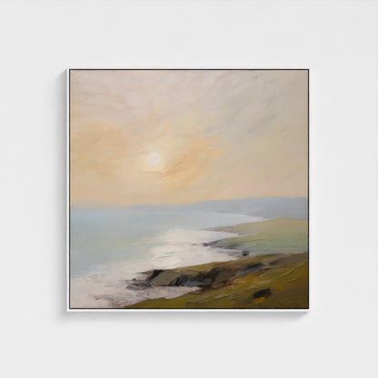 Framed artwork of a landscape with a sunset over a body of water.