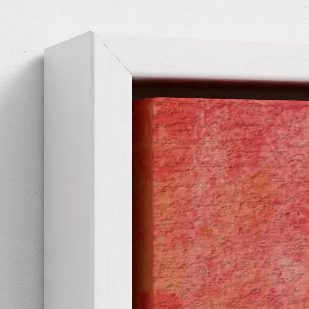 Close-up of a textured red painting with a white frame on a light gray background