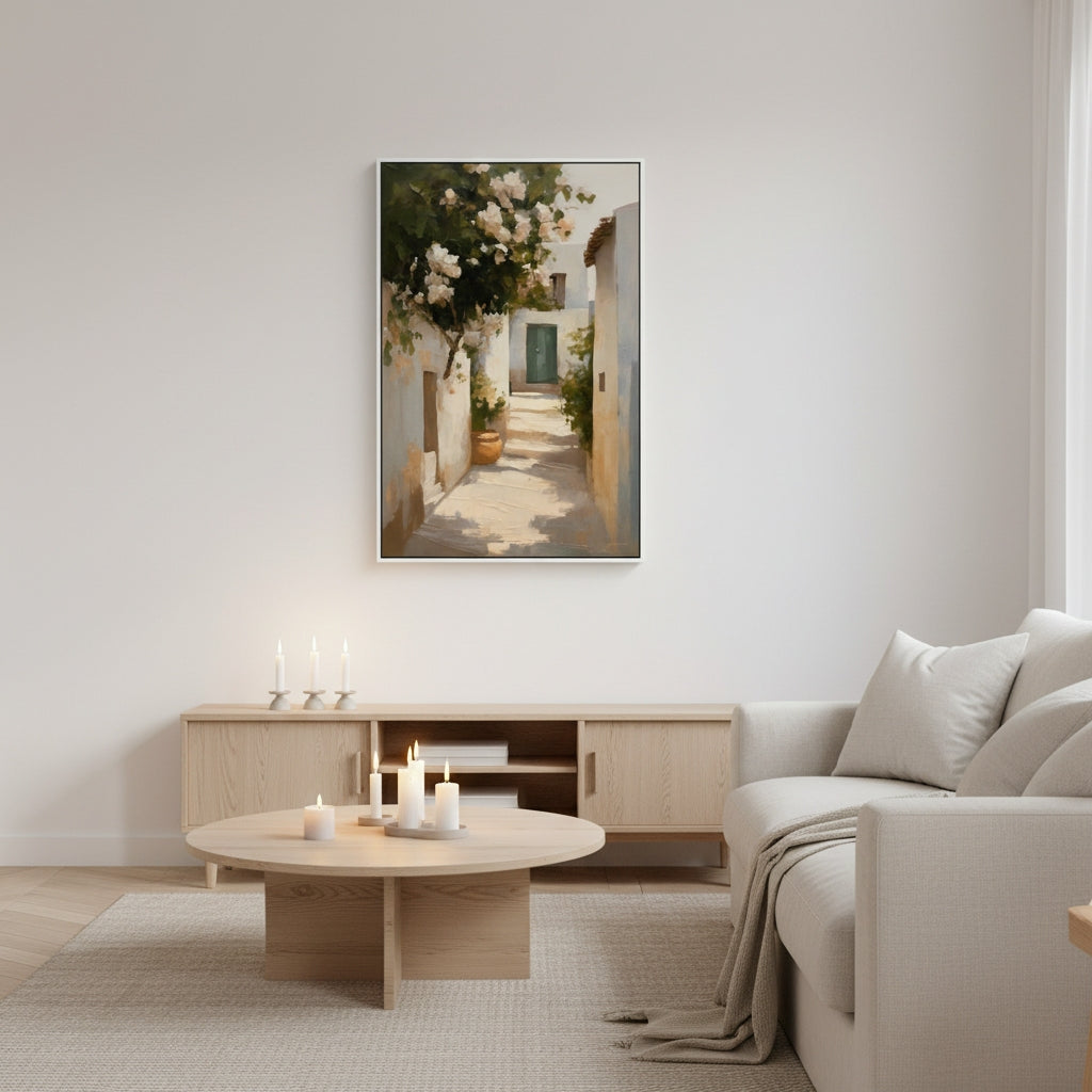 Living room with a painting of a sunlit street scene on the wall, a sofa, and a coffee table.