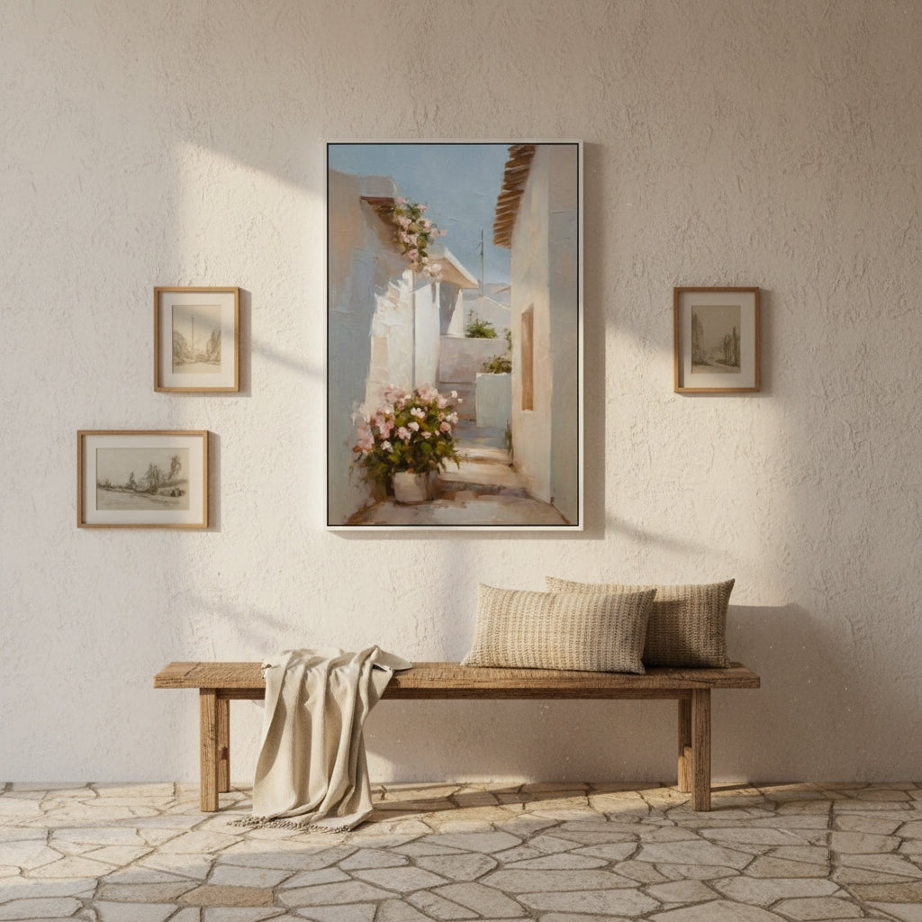Mediterranean -themed wall art above a wooden bench with pillows in a sunlit room.