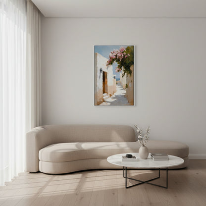 Modern living room with a beige sofa, white coffee table, and framed artwork on the wall.