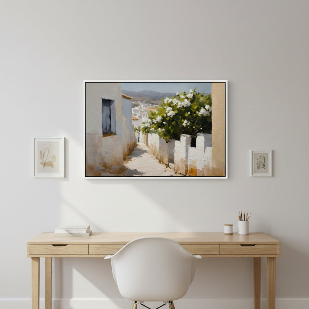 Home office with a desk, chair, and framed artwork on a wall.
