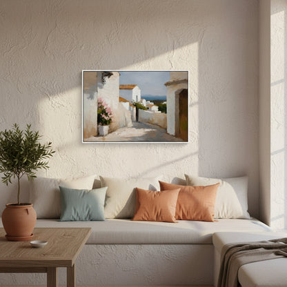 Living room with a sofa, cushions, a plant, and a framed picture on the wall.