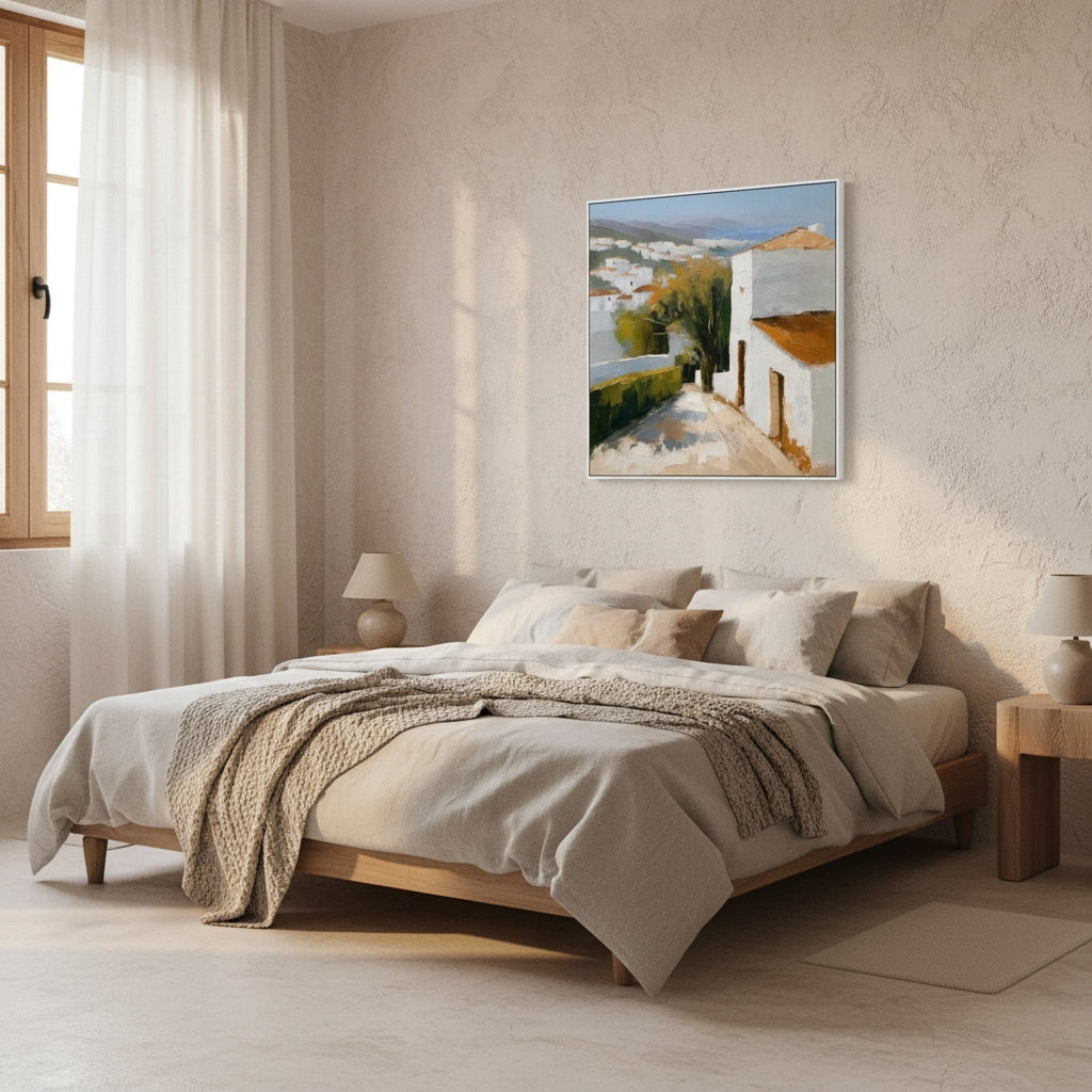 Bedroom with a bed, lamp, and painting on the wall