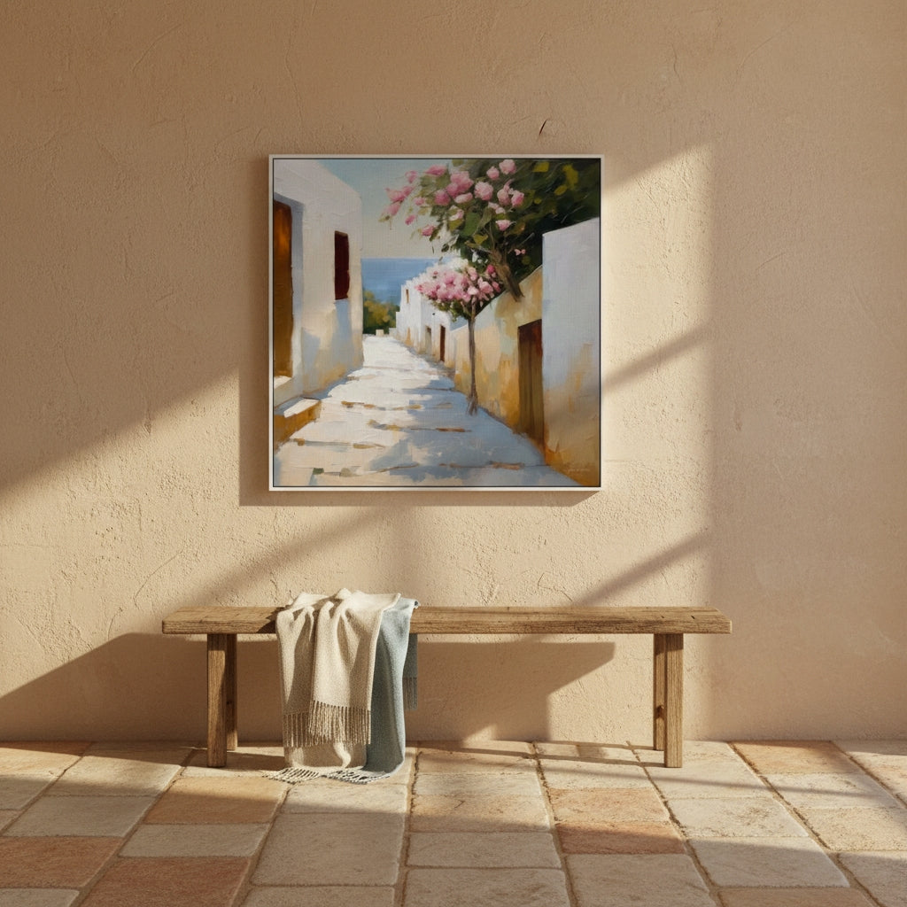 Painting of a sunlit street with flowers on a beige wall above a wooden bench.