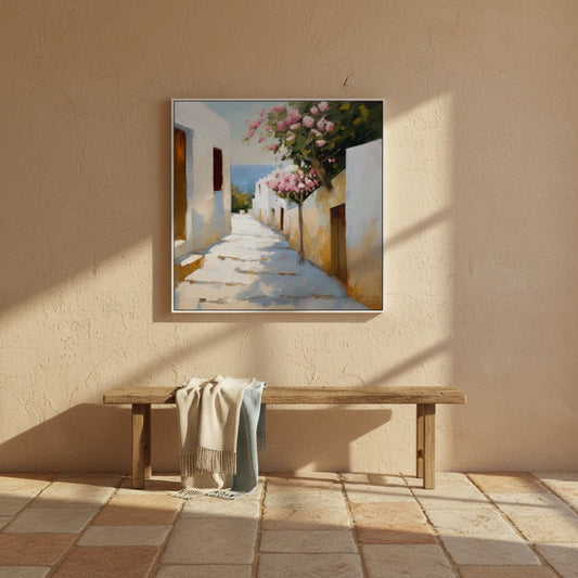 Painting of a sunlit street with flowers on a beige wall above a wooden bench.