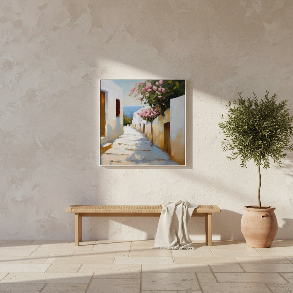 Framed painting of a coastal scene on a wall above a wooden bench with a plant beside it.