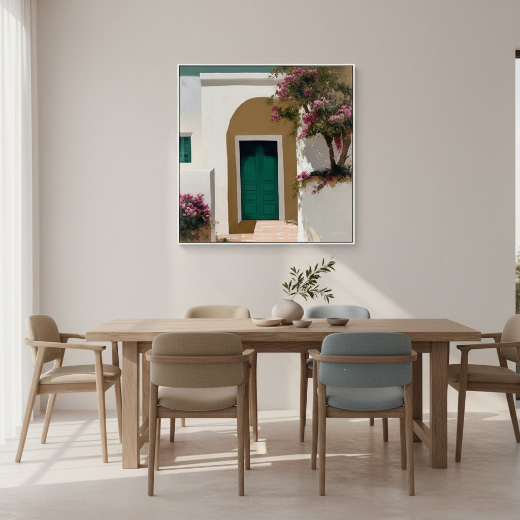 Dining room with wooden table and chairs, framed artwork on the wall.