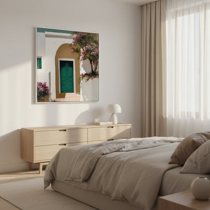 Modern bedroom with a dresser, bed, and decorative mirror.