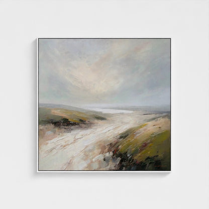 Framed painting of a landscape with a cloudy sky on a white wall