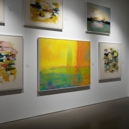 Art gallery with abstract paintings on a white wall