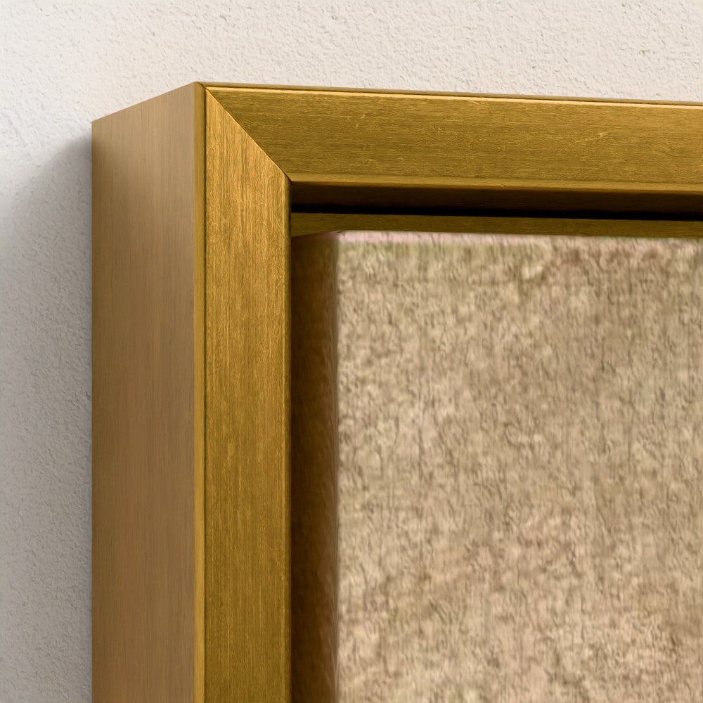 Close-up of a gold picture frame corner on a textured wall.