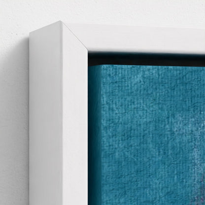 Close-up of a white frame with a textured blue canvas inside on a light gray background