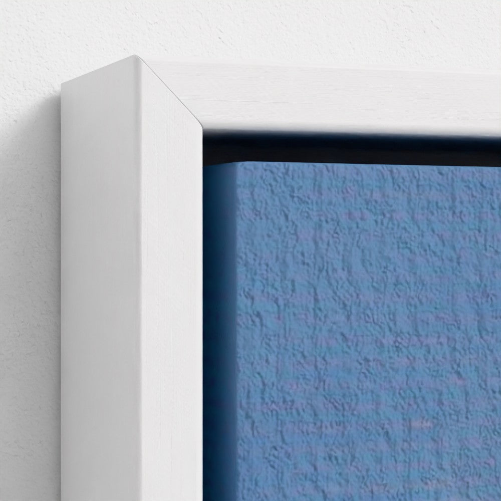 Close-up of a textured blue surface with a white frame.
