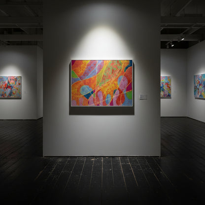 Art gallery with colorful abstract paintings on white walls