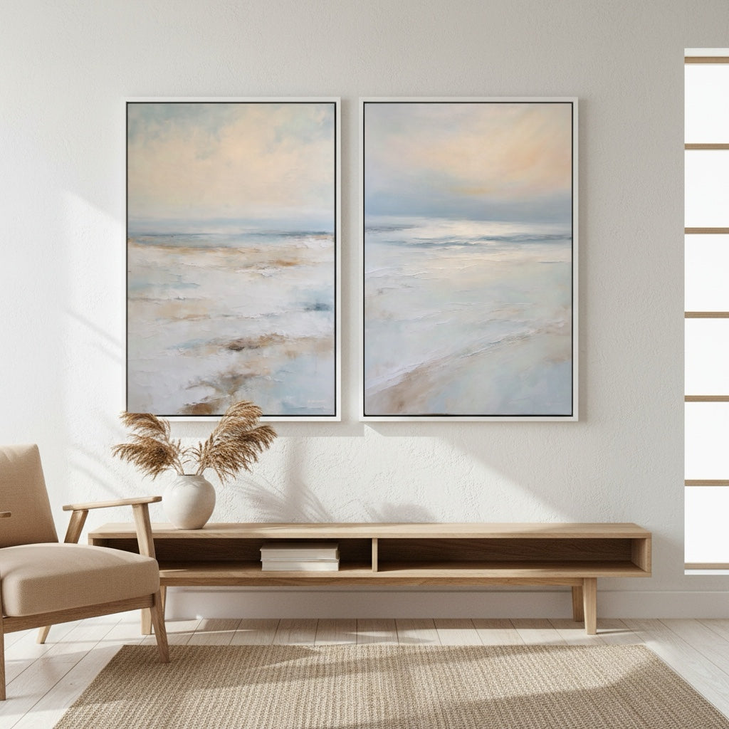 Two abstract paintings on a wall above a wooden console table in a room with natural light.