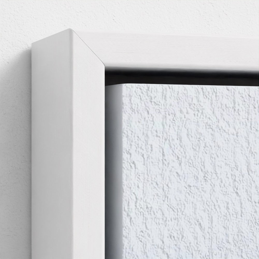 Close-up of a white frame corner with a textured white wall background