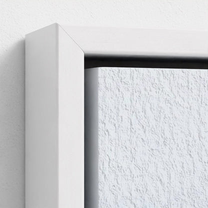 Close-up of a white frame corner with a textured white wall background