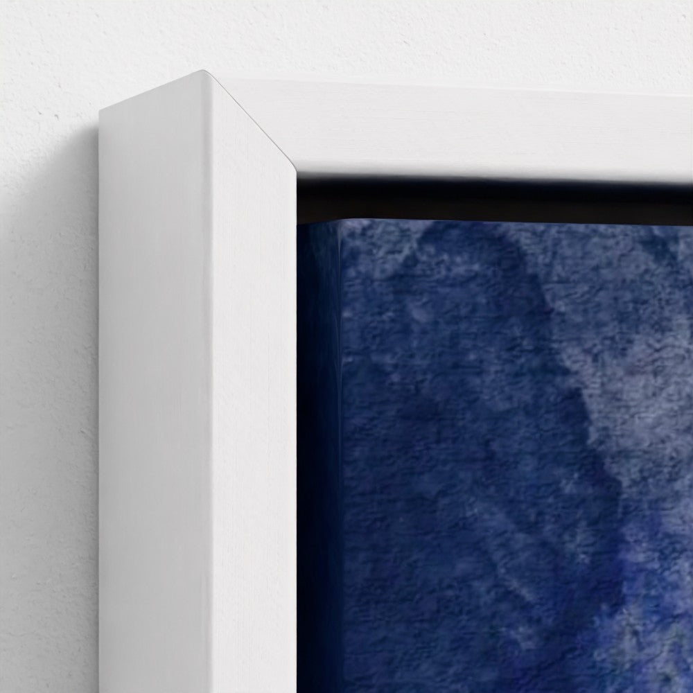 Close-up of a white frame corner with a textured blue artwork inside.