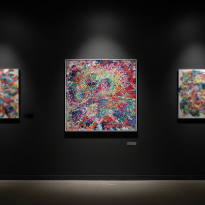 Colorful abstract painting on a dark wall with spotlight effect