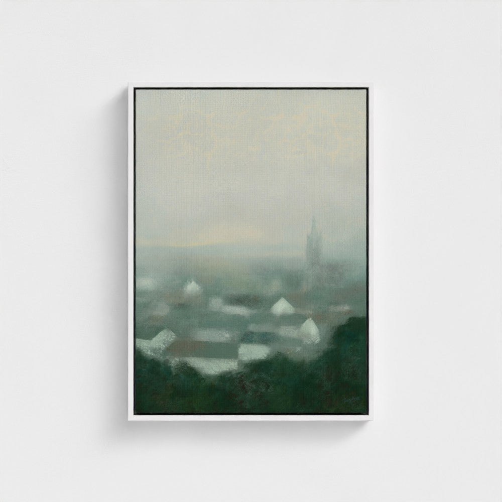 Framed artwork of a landscape with a tower and misty atmosphere on a white background